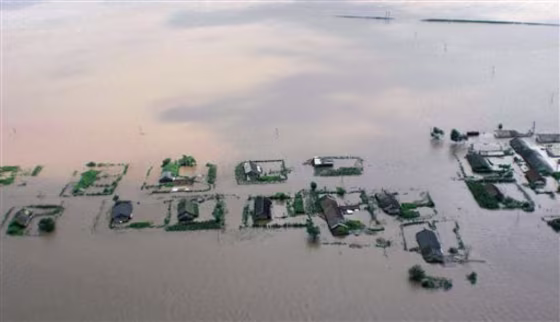 Floodwaters inundate houses and farmland&nbsp;in the North Korean city of Sinuiju. About a foot&nbsp;of rain&nbsp;Saturday sent&nbsp;the Yalu, or Amnok as its known in Korean, river&nbsp;over its&nbsp;banks.